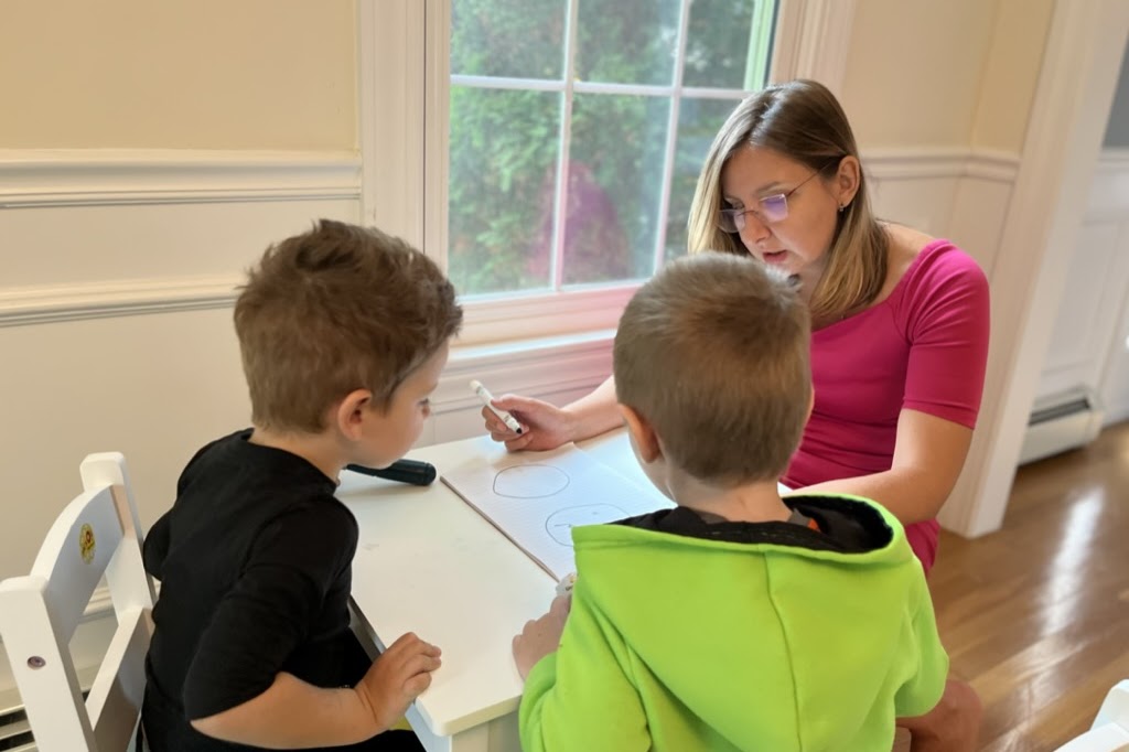 Dr. Kat speaking with a student
